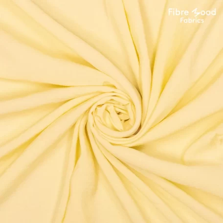 Deze gele modal polyester stof wordt gebruikt voor Fibre Mood model Phyllis en is duurzaam gemaakt volgens de OEKO-TEX Standard 100.