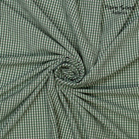 Deze mooie stof heeft een grijs/groen/witte ruit en een kreukeleffect zoals een seersucker en wordt gebruikt voor Fibre Mood model Lulu en is duurzaam gemaakt volgens de OEKO-TEX Standard 100.