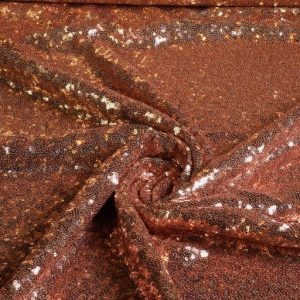 Mesh stof met mooie stretch in de breedte en lichte stretch in de lengte, voorzien van all-over gestikte pailletten van ca. 3 mm. Zachte achterkant die op de huid gedragen kan worden