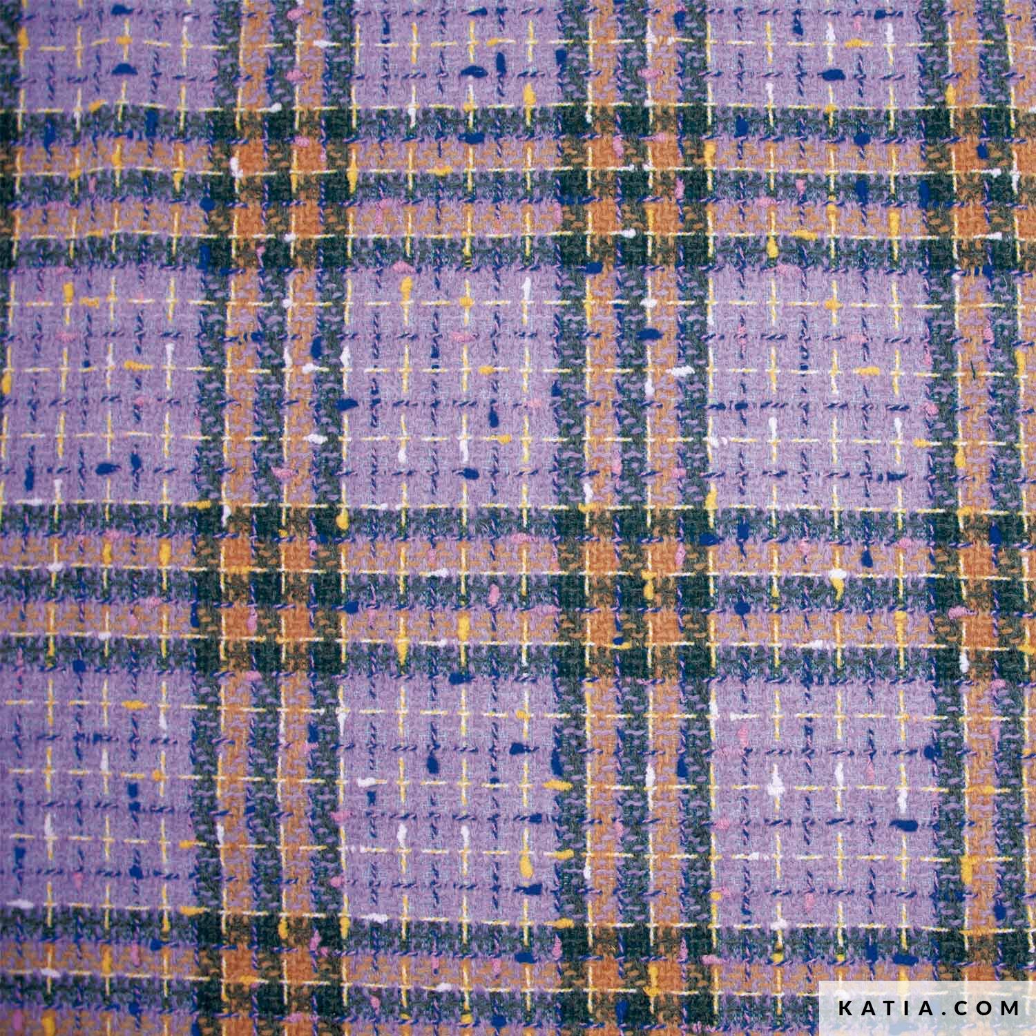 De Katia Soho tweed jasstof is geïnspireerd door stedelijke verfijning en heeft een Welsh ruitpatroon in lavendel- en blauwtinten, waardoor een klassieker een moderne draai krijgt