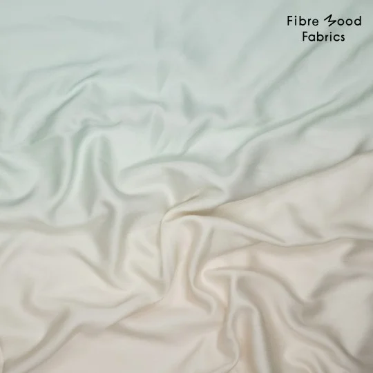 Deze geweven lyocell satin print met verloop van mintgroen naar ecru wordt gebruikt voor Fibre Mood model Ronya en is duurzaam gemaakt volgens de OEKO-TEX Standard 100.