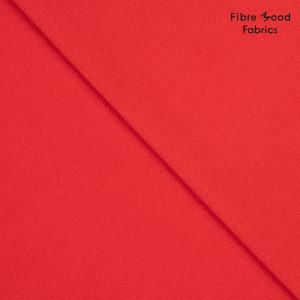 Deze elastische polyester-viscose crepé in de kleur rood wordt gebruikt voor Fibre Mood model Yuna en is duurzaam gemaakt volgens de OEKO-TEX Standard 100.